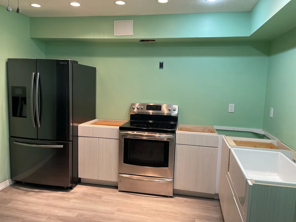 kitchen after cabinets installed during